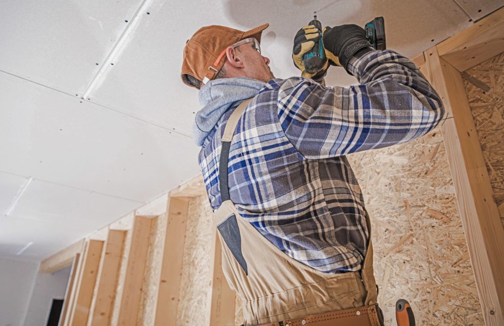 construction-contractor-attaching-drywall